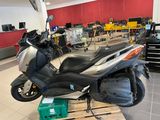a scooter that is sitting on a pallet in a garage