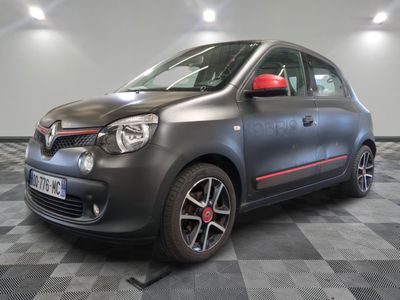 a picture of a grey and red car parked in a garage