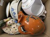 a box full of different types of teapots and bowls
