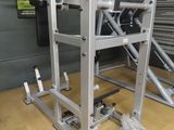 a close up of a gym equipment rack on a wooden floor