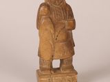 an image of a wooden statue of a woman holding a child