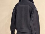 an image of a coat on a mannequin stand