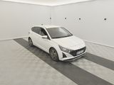 the white car is parked in the empty room of the building
