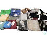 a pile of clothing that is sitting on a white surface