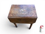 a small wooden table with a star on it