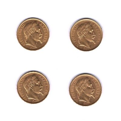 un ensemble de quatre pièces d'or représentant la tête d'un homme et d'une femme
