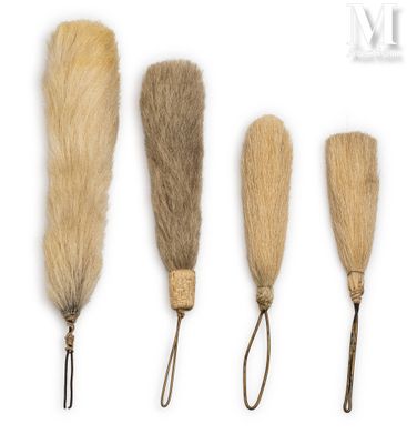 four different types of fur brushes on a white background