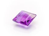 a square purple amethorate stone on a white background
