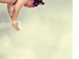 a man flying through the air on a surfboard