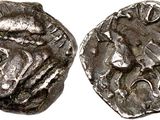 a silver coin with an image of a man on it
