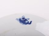a white plate with a blue design on it