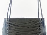 black leather purse with a zippered strap and a metal clasp