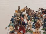 many figurines that are on display on a table