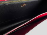 the inside of a red and black purse with a zipper