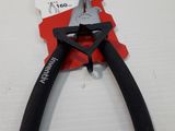 a pair of pliers sitting on top of a piece of paper