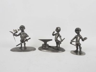 three metal figurines of a boy with a sword and a bowl