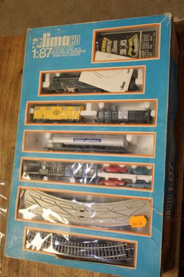 a box with a train set in it sitting on a table