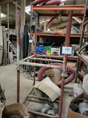 a pile of assorted items sitting in a warehouse