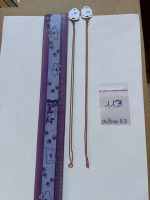 a purple and white bookmark with a chain on top of it