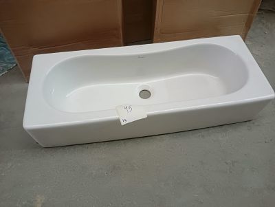 a white bath tub sitting on the floor in a room