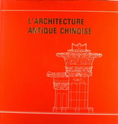 un livre rouge sur lequel est dessiné une tour