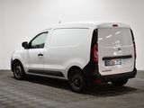 the back of a white van parked in a room with a checkered floor