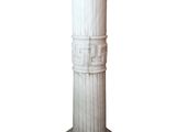 a tall white column with a decorative design on it