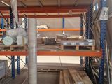 many shelves in the warehouse with various items on them