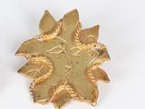 pair of gold tone flower earrings with leaves on a white background