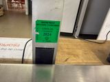 an image of a sign on a conveyor belt in a warehouse