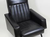 leather lounge chair with black upholstered seat and metal legs