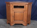 an image of a corner cabinet with a door