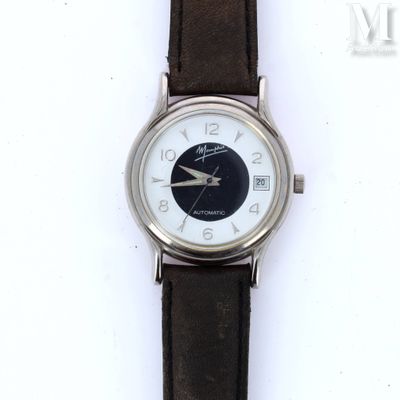 a close up of a wrist watch with a black and white face