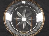 a glass plate with a design on it on a black background