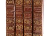 un ensemble de cinq livres anciens reliés en cuir avec des bordures dorées