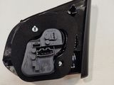 a close up of a black electrical device on a white surface