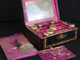 a small box with a mirror and some other items in it