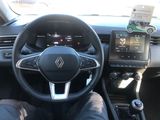 the interior of a car with a steering wheel and dashboard controls