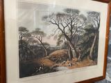 framed print of a painting of a hunting scene in a wood frame