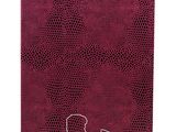 the cover of a notebook with the logo of a woman ' s name on it