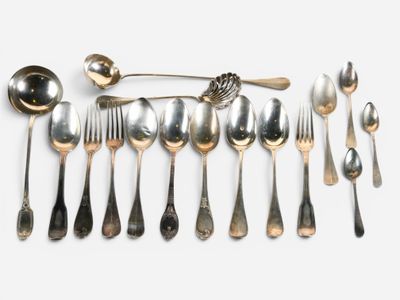 a lot of silver spoons and spoon spoons on a table