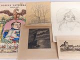 several old books with drawings and pictures on them on a table