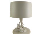 a white lamp with a white shade on it