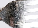 a close up of a fork with a metal handle