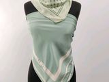 an image of a woman wearing a scarf on a mannequin