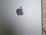 an apple ipad is sitting on a table with a charger attached to it