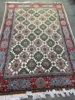 an oriental rug with a red, green, and blue design