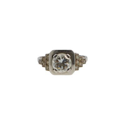 a close up of a diamond ring on a white background