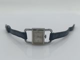 a close up of a watch on a white surface with a black strap