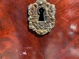 a close up of a wooden door with a keyhole